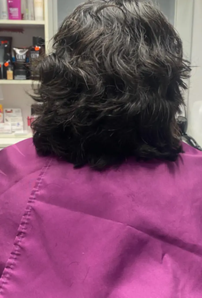 Short dark haircut with natural texture
